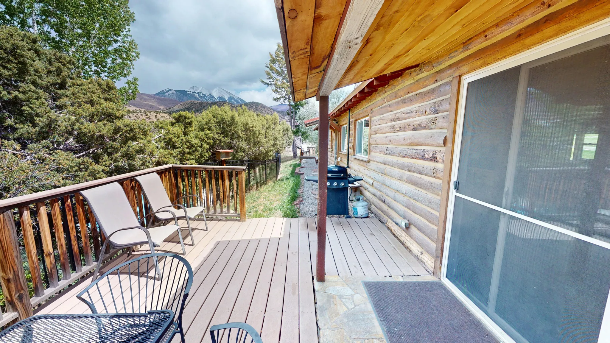 Wooden terrace with a mountain view and grilling area