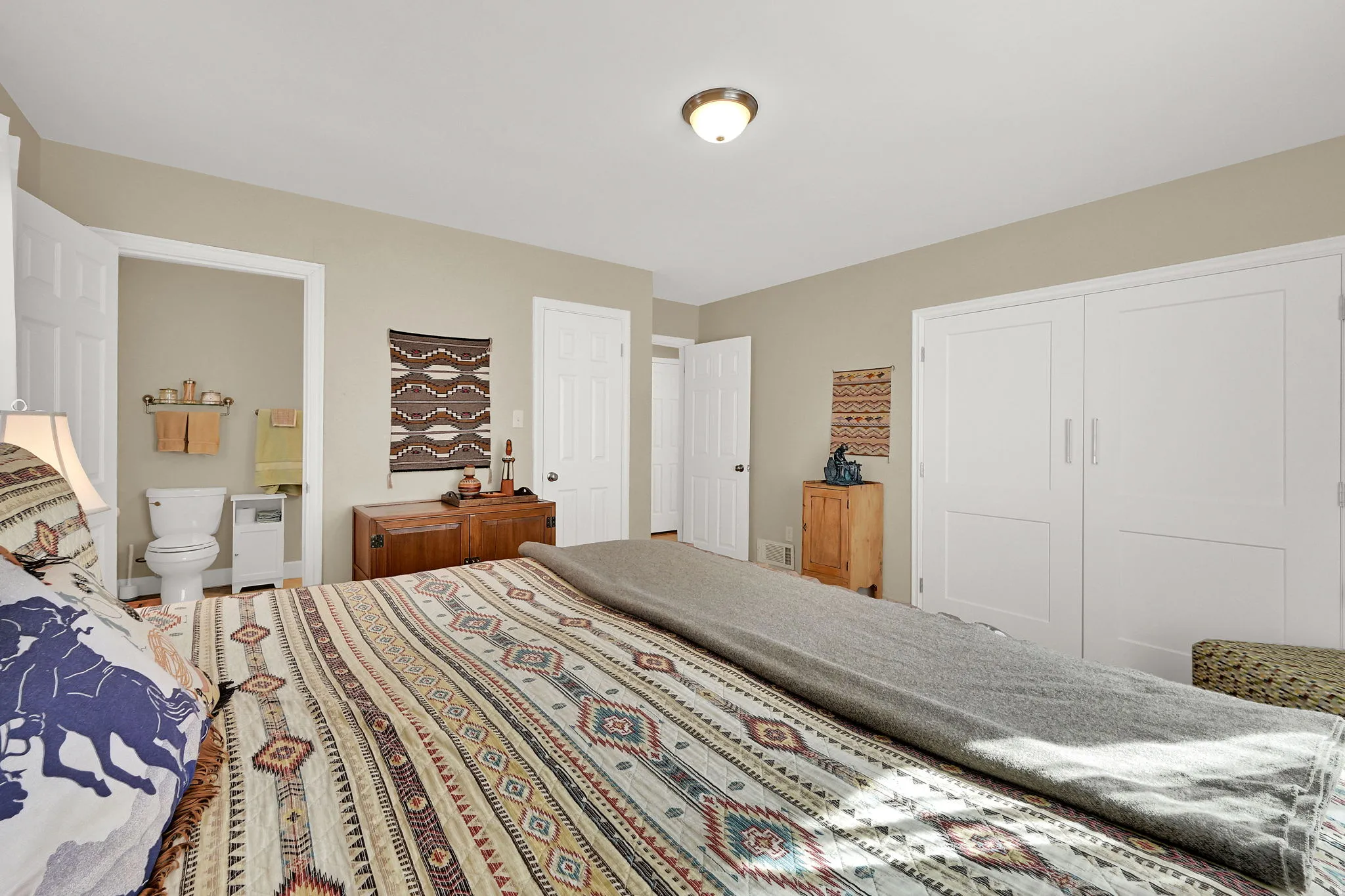 Spacious primary bedroom with 2 closets and en-suite bathroom