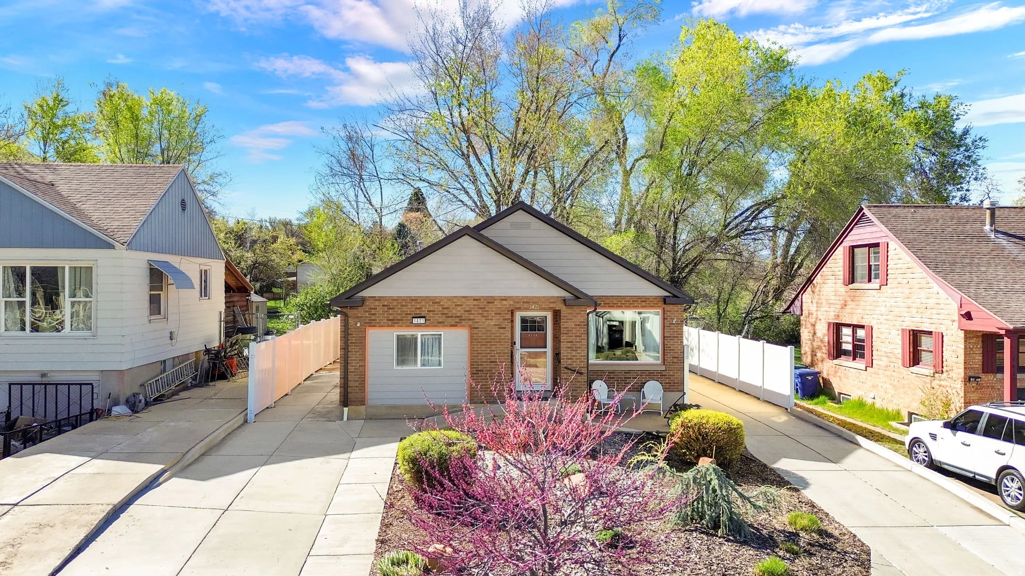 Bungalow-style home featuring brick siding and driveway
