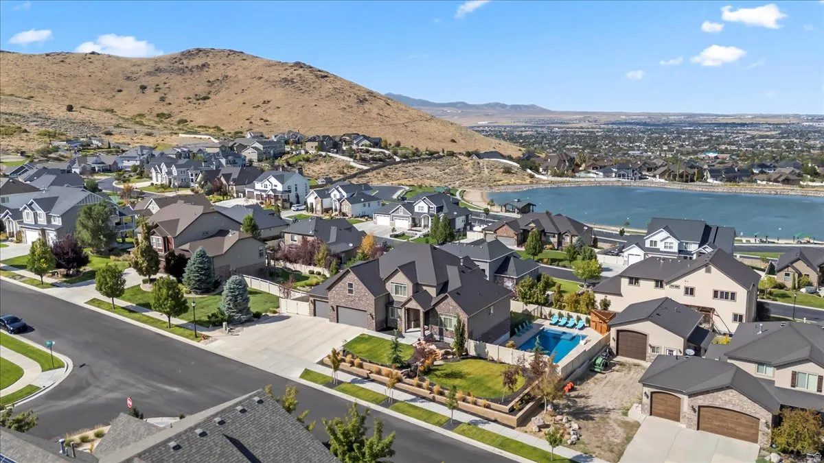 Aerial perspective of suburban area featuring a water and mountain view