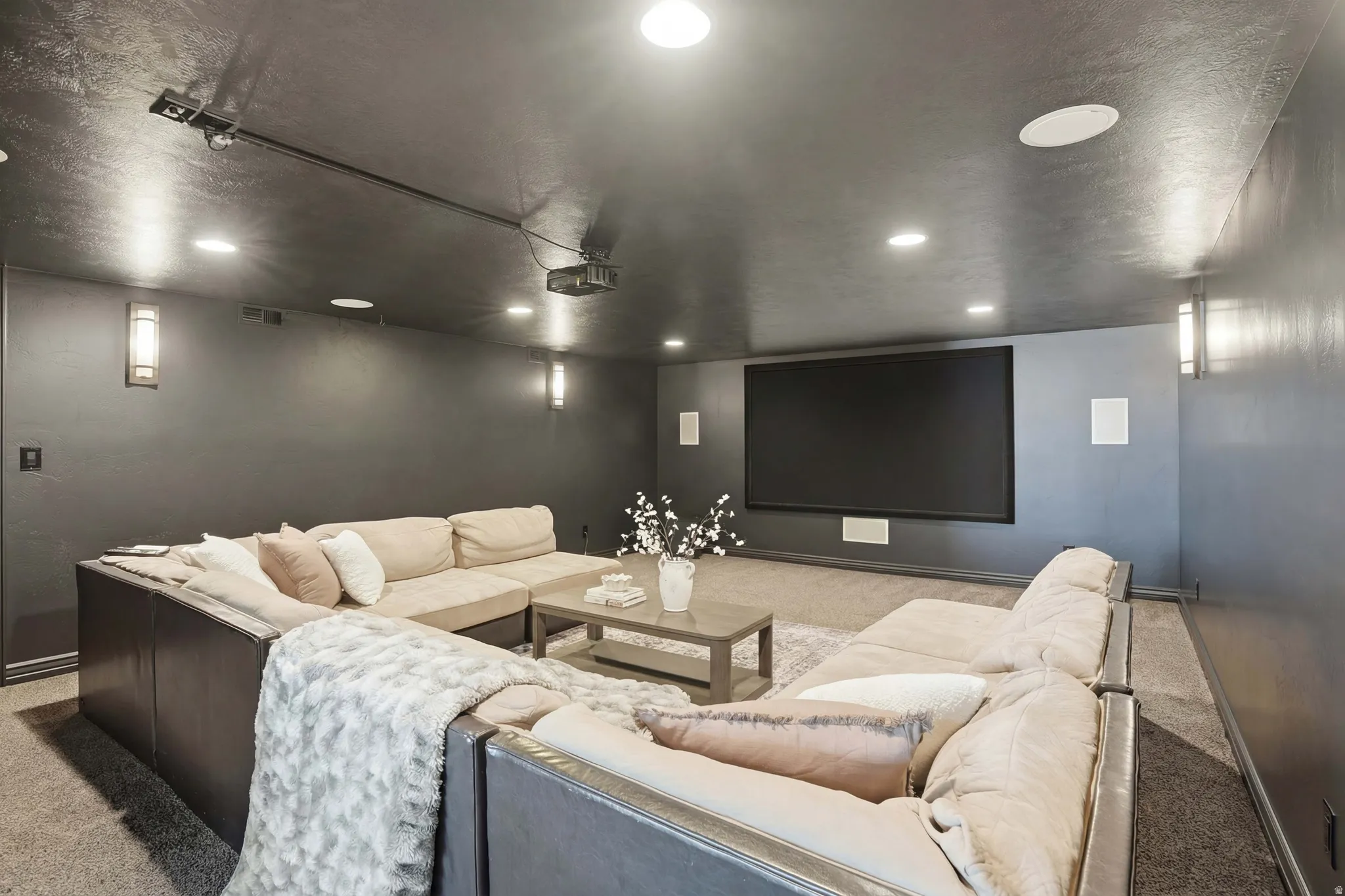 Home theater room featuring light carpet and recessed lighting