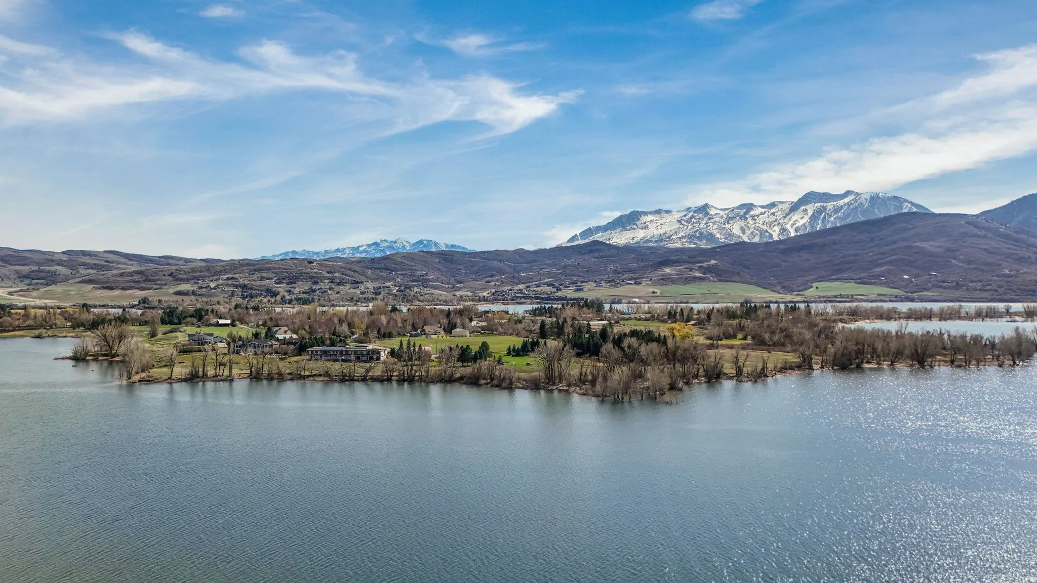 Expansive lakefront property with surrounding mountainous terrain