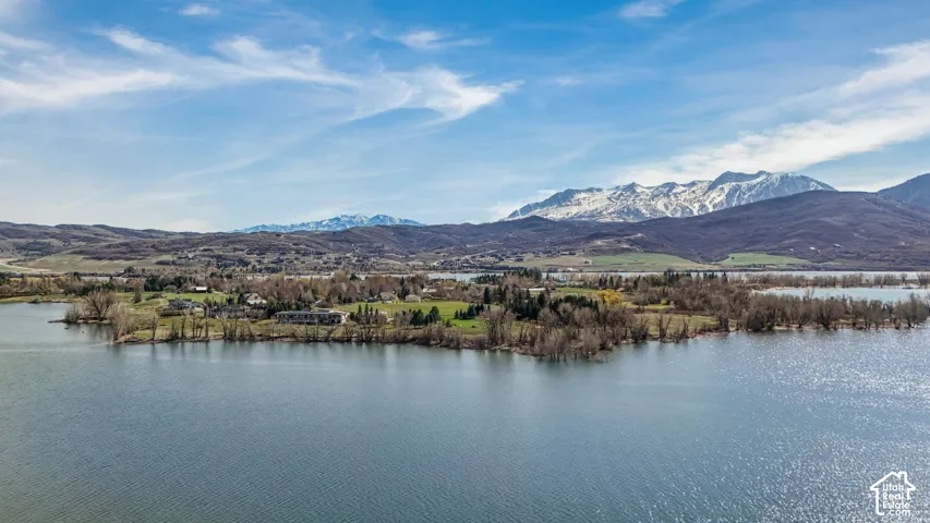 Expansive lakefront property with surrounding mountainous terrain