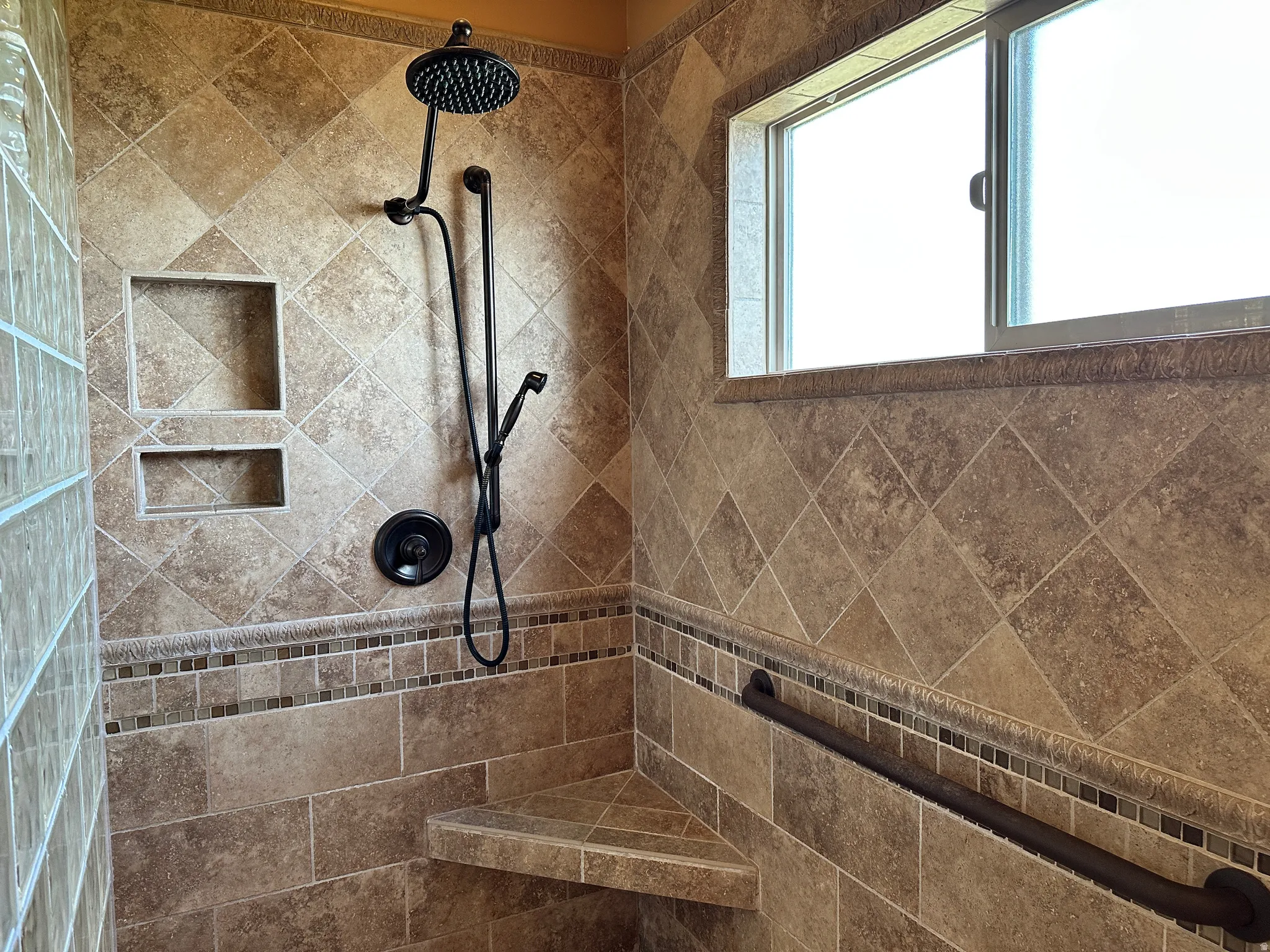 Shower featuring a tile shower