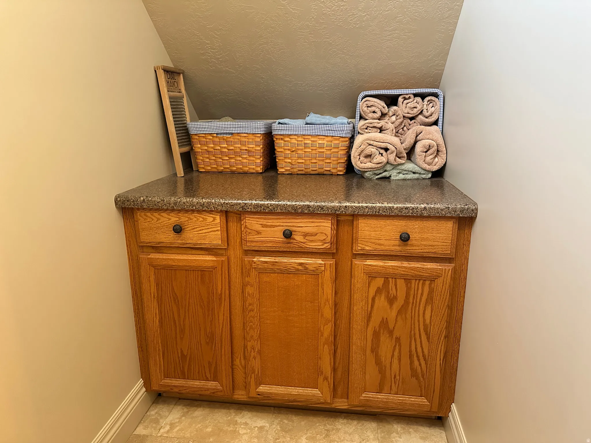 Folding table and cupboards in room adjacent to the laundry