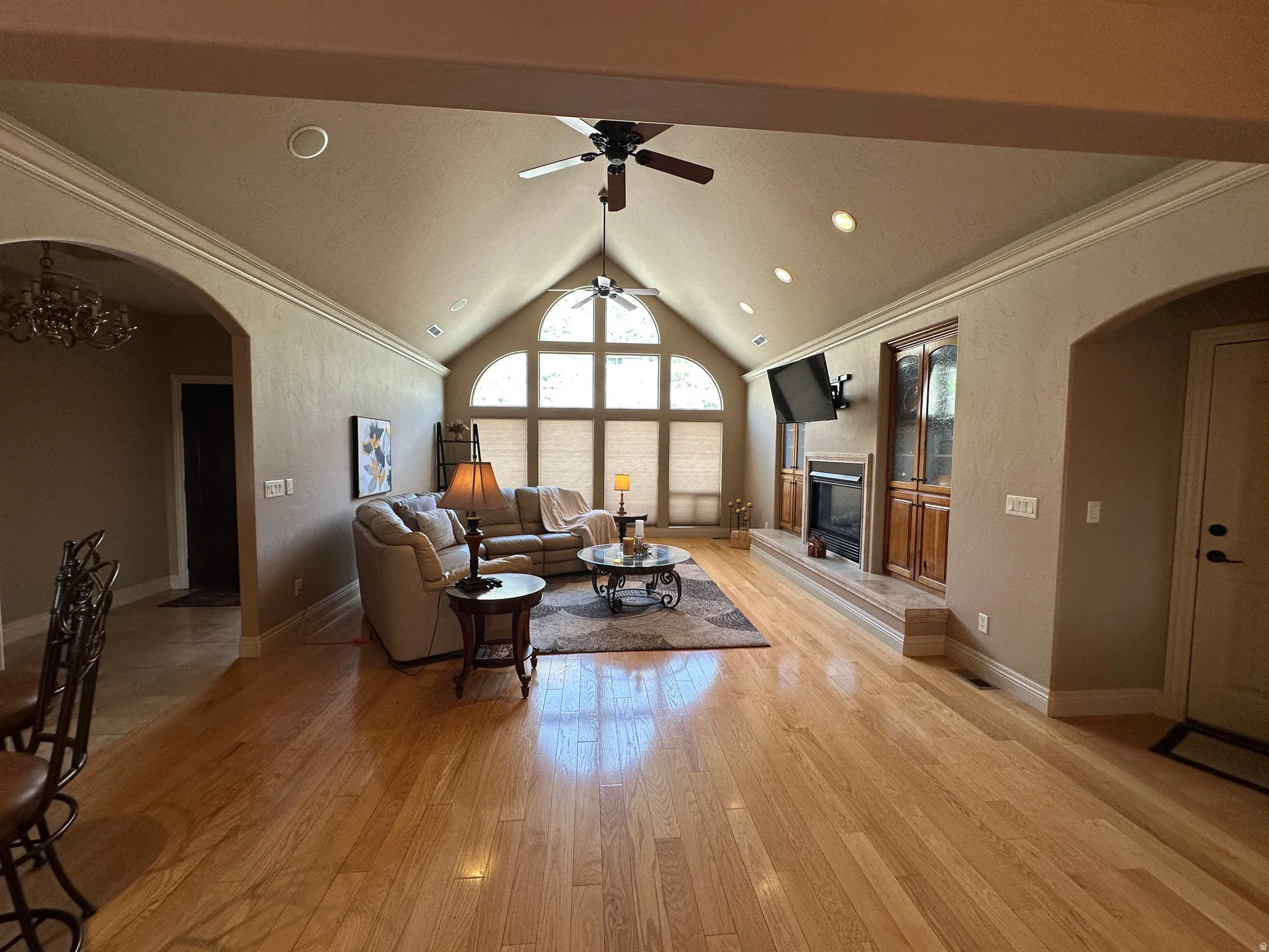 Great room with wood flooring, gas fireplace and vaulted ceiling