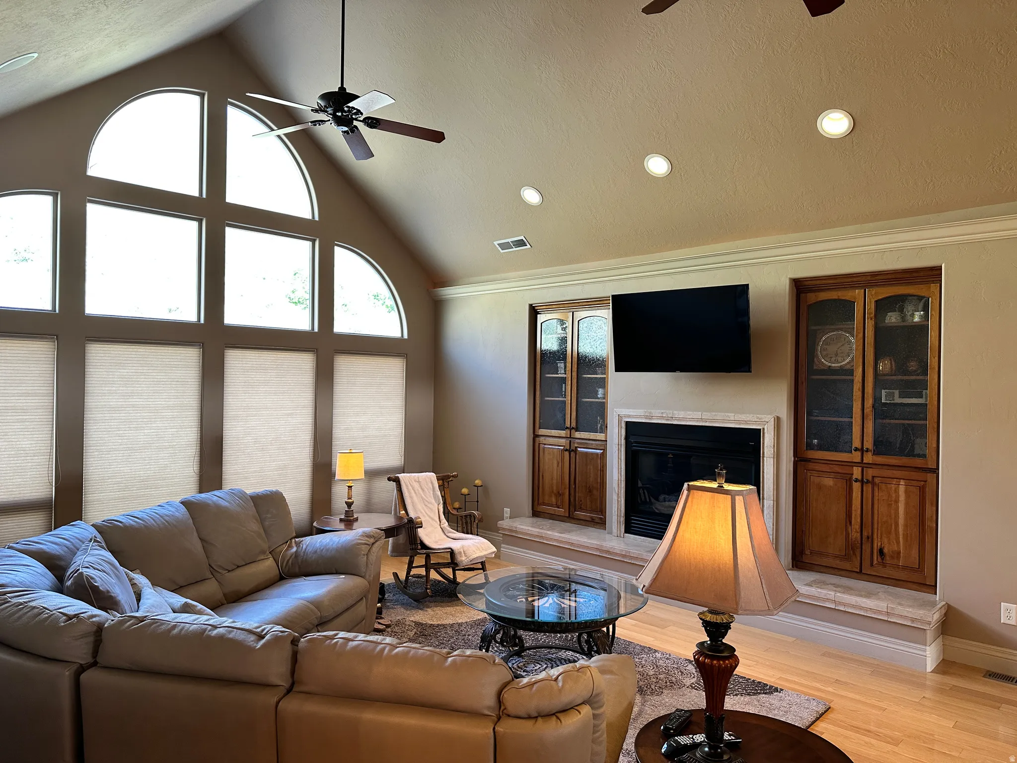 Glass front fire place with wood built in on each side