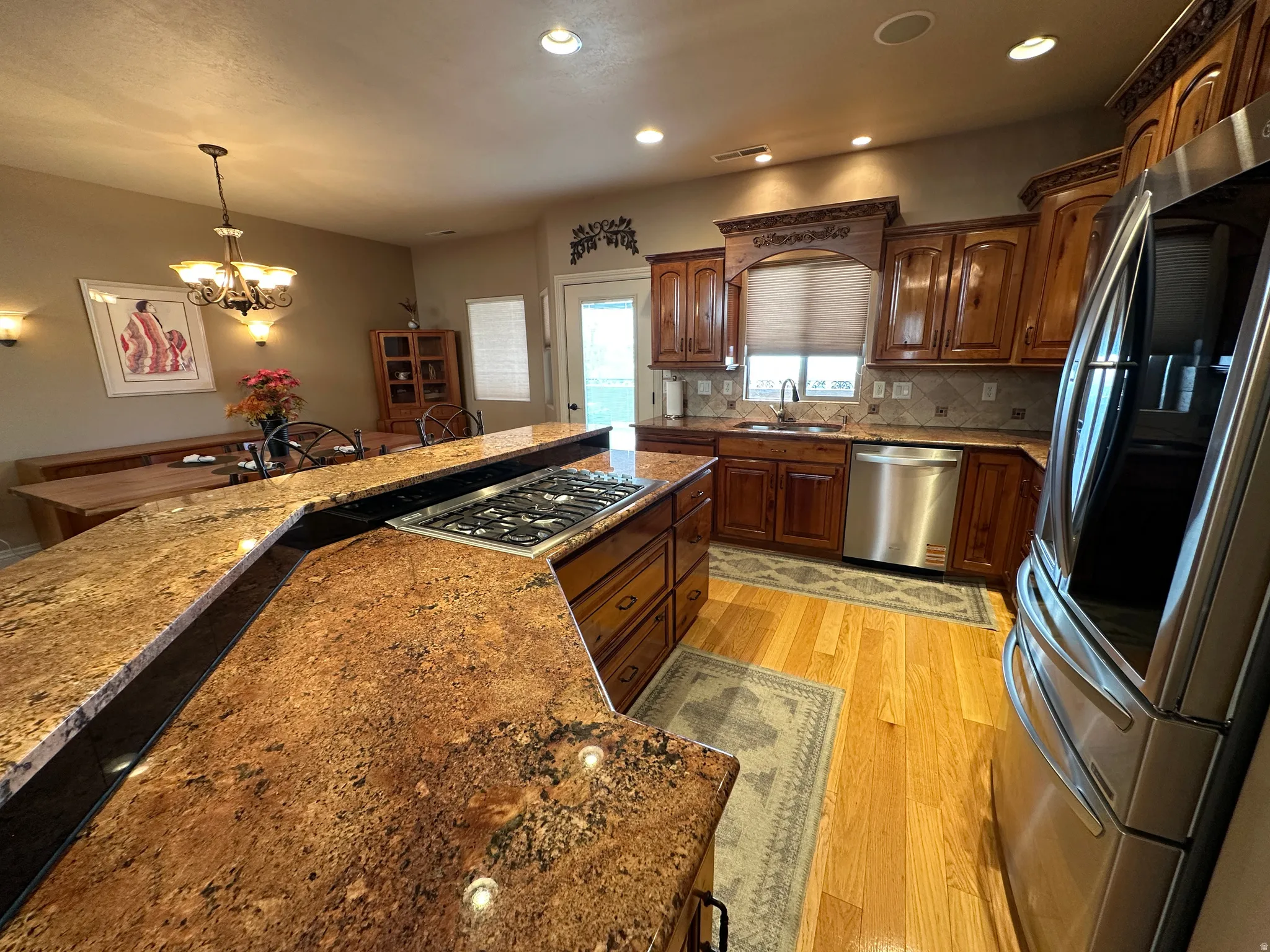Granite kitchen with space for a few people to be working together