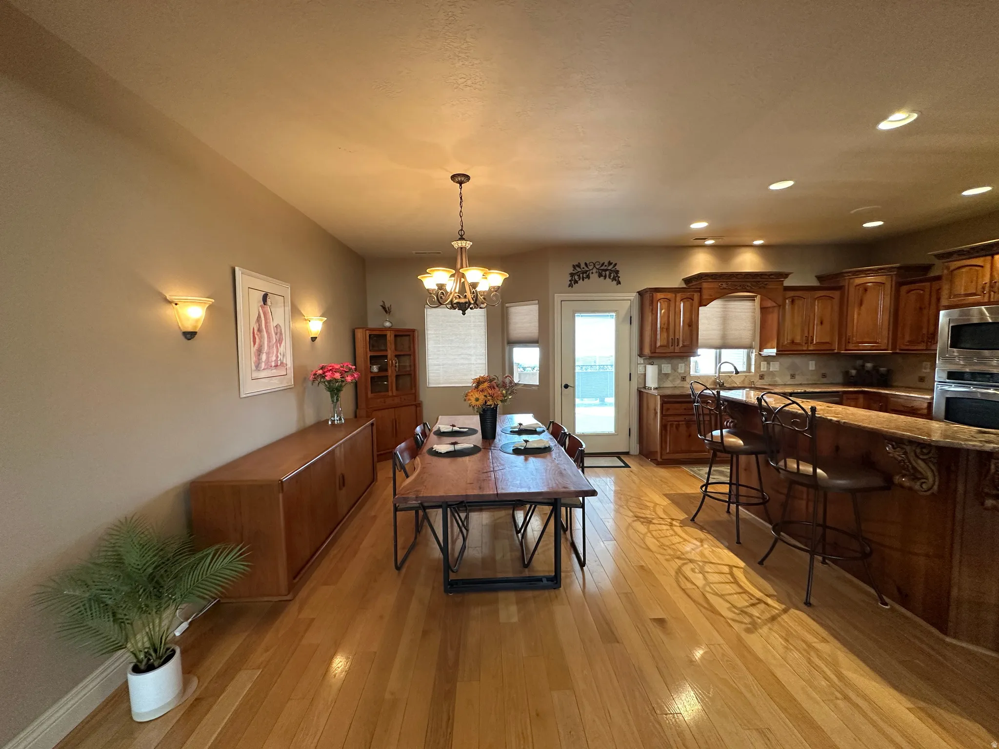 DIning area with wood floors and view of Willard Bay