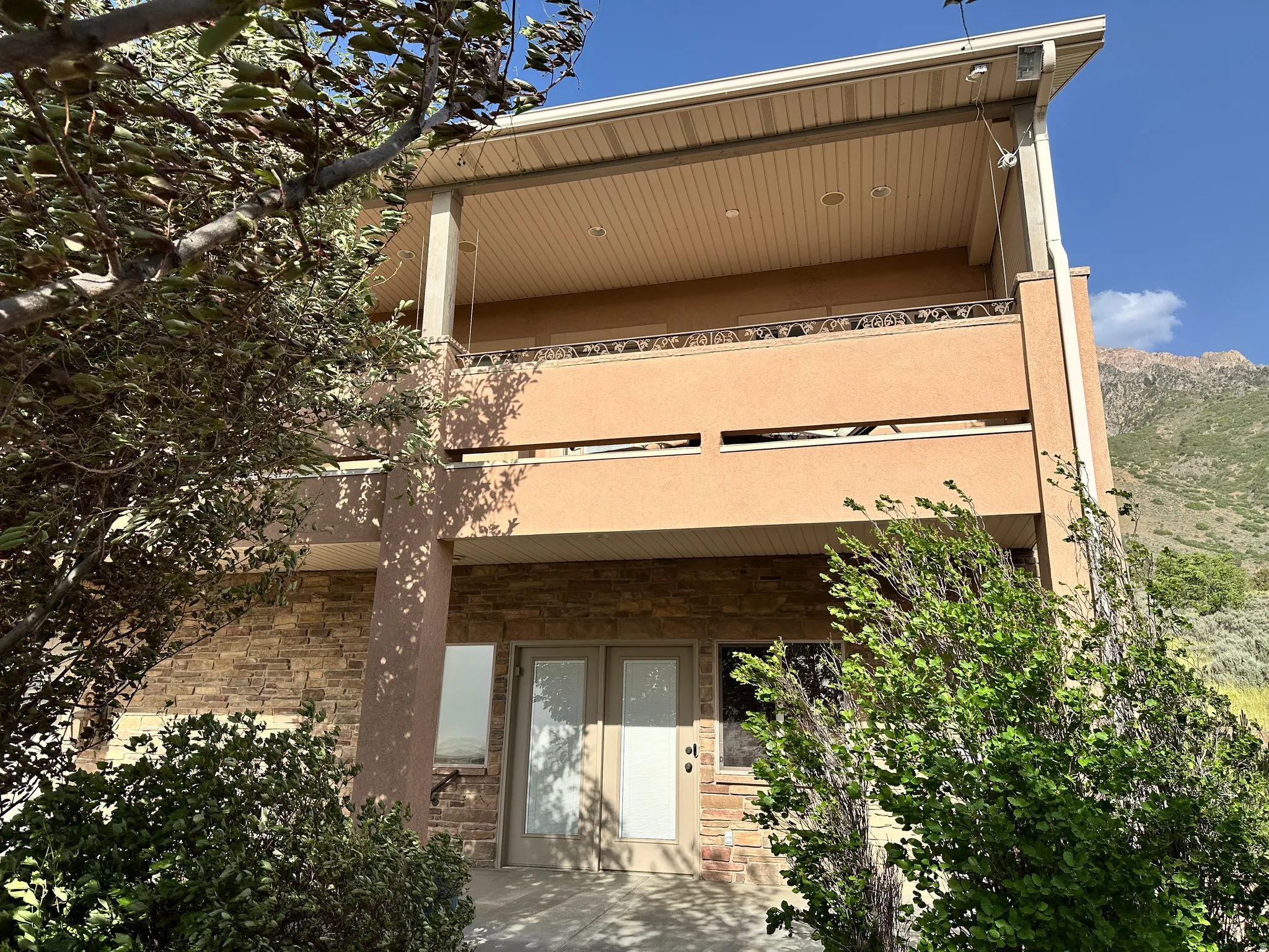 Lower level entry with deck above
