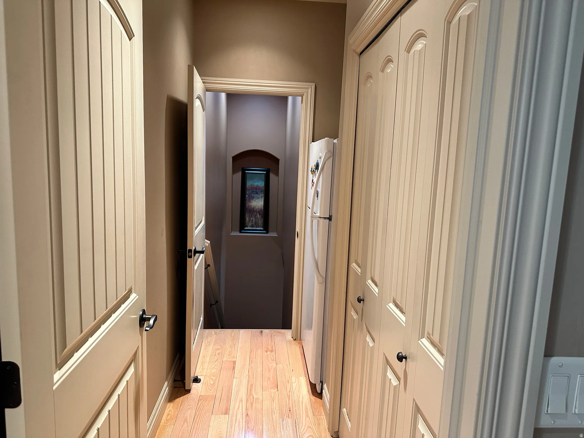 Corridor with closet for storage leading to stairway to the basement