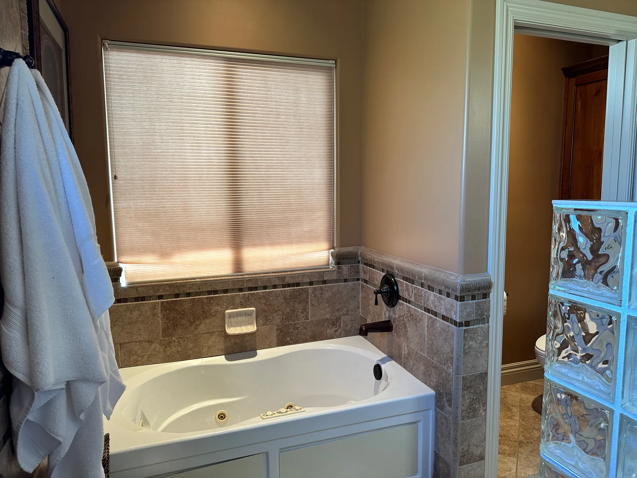 Primary bathroom featuring a whirlpool tub