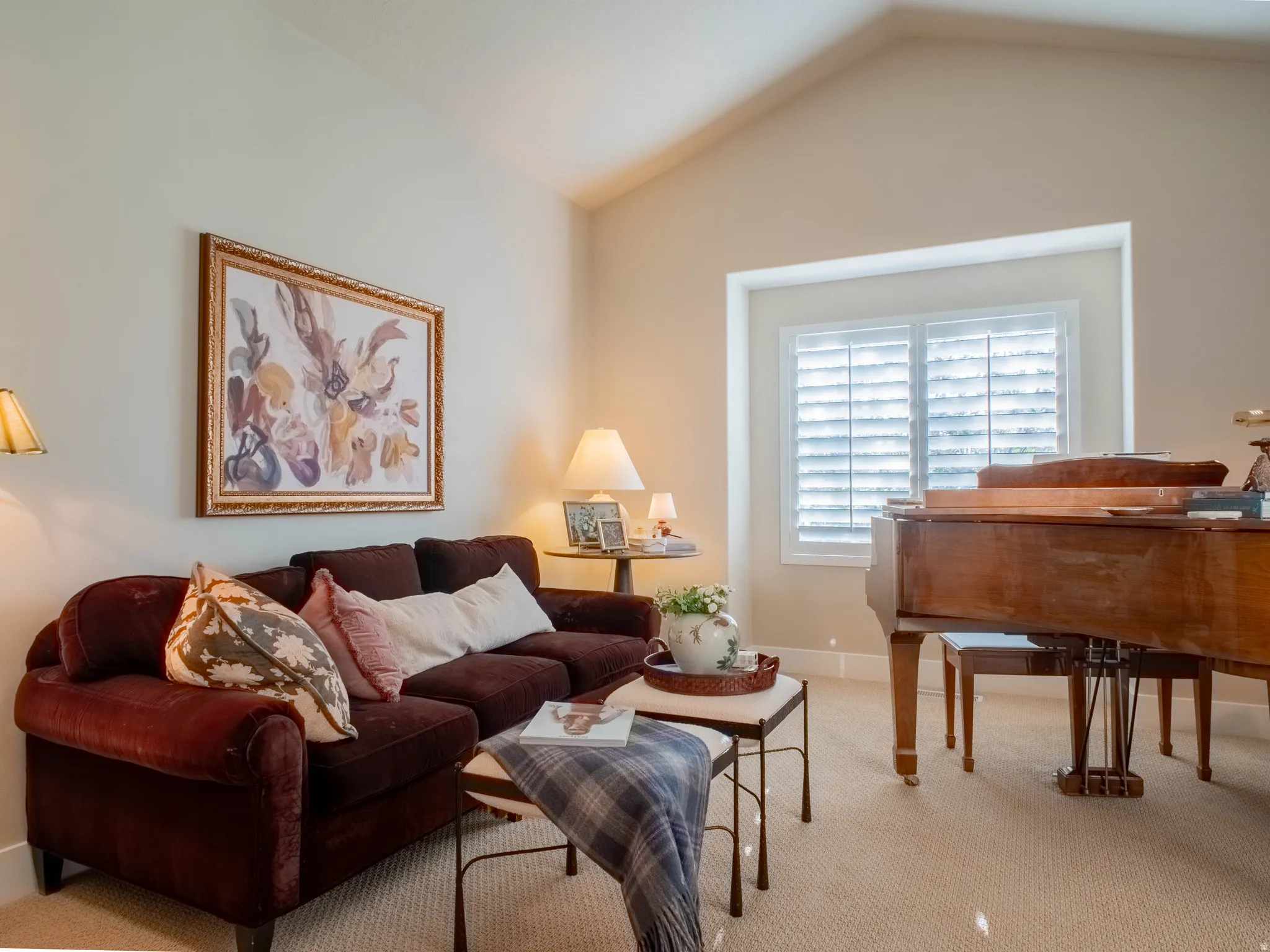 Living room featuring light colored carpet and baseboards