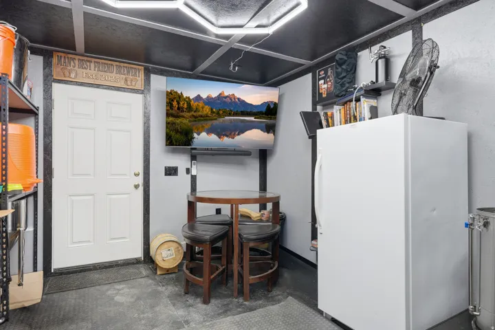 Basement featuring freestanding refrigerator