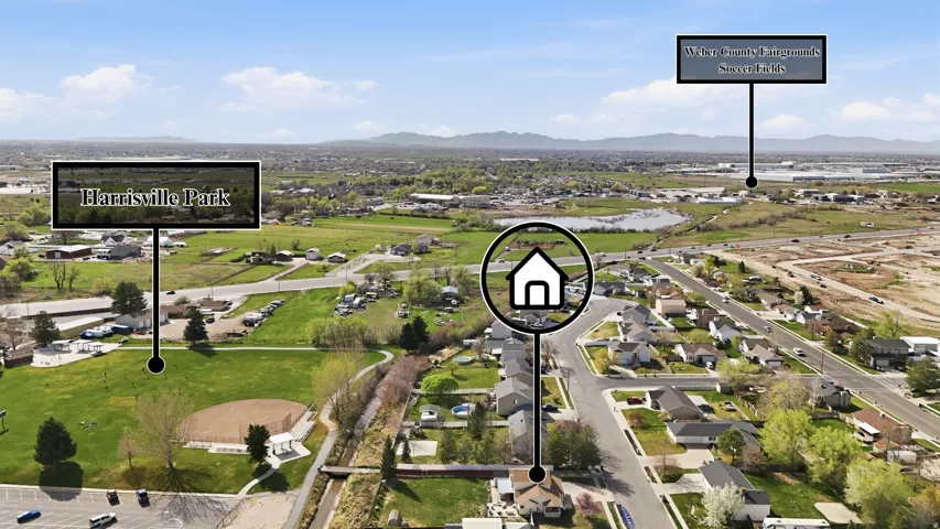 Aerial perspective of suburban area featuring a mountain backdrop