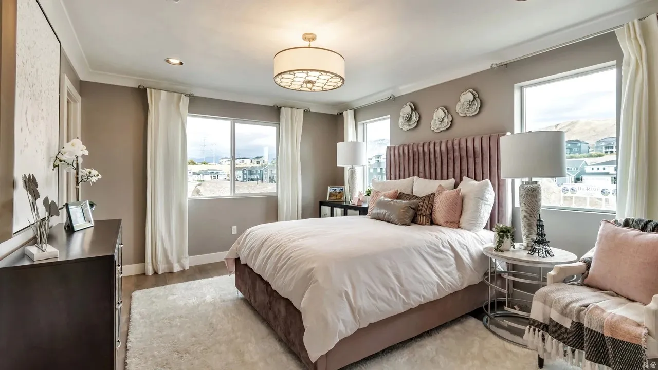Bedroom featuring wood finished floors, recessed lighting, and crown molding
