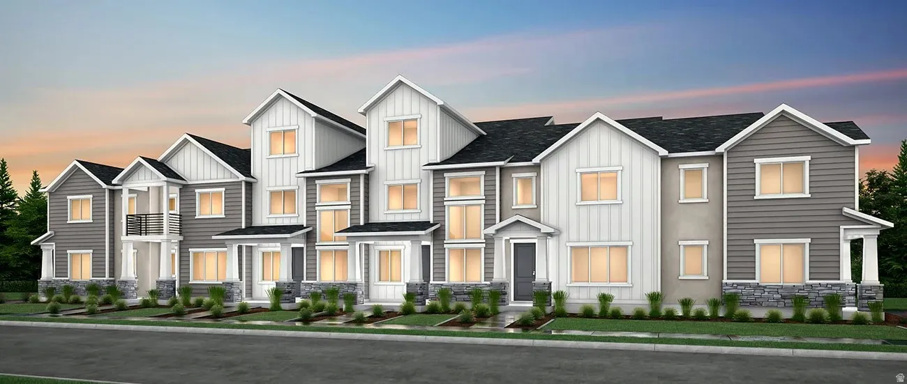 Modern farmhouse style home featuring board and batten siding, stone siding, and roof with shingles