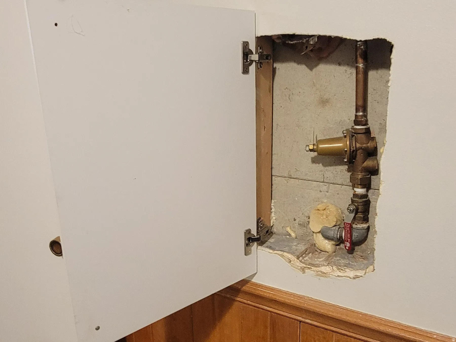 Detailed view of wooden walls, carpet flooring, and wainscoting