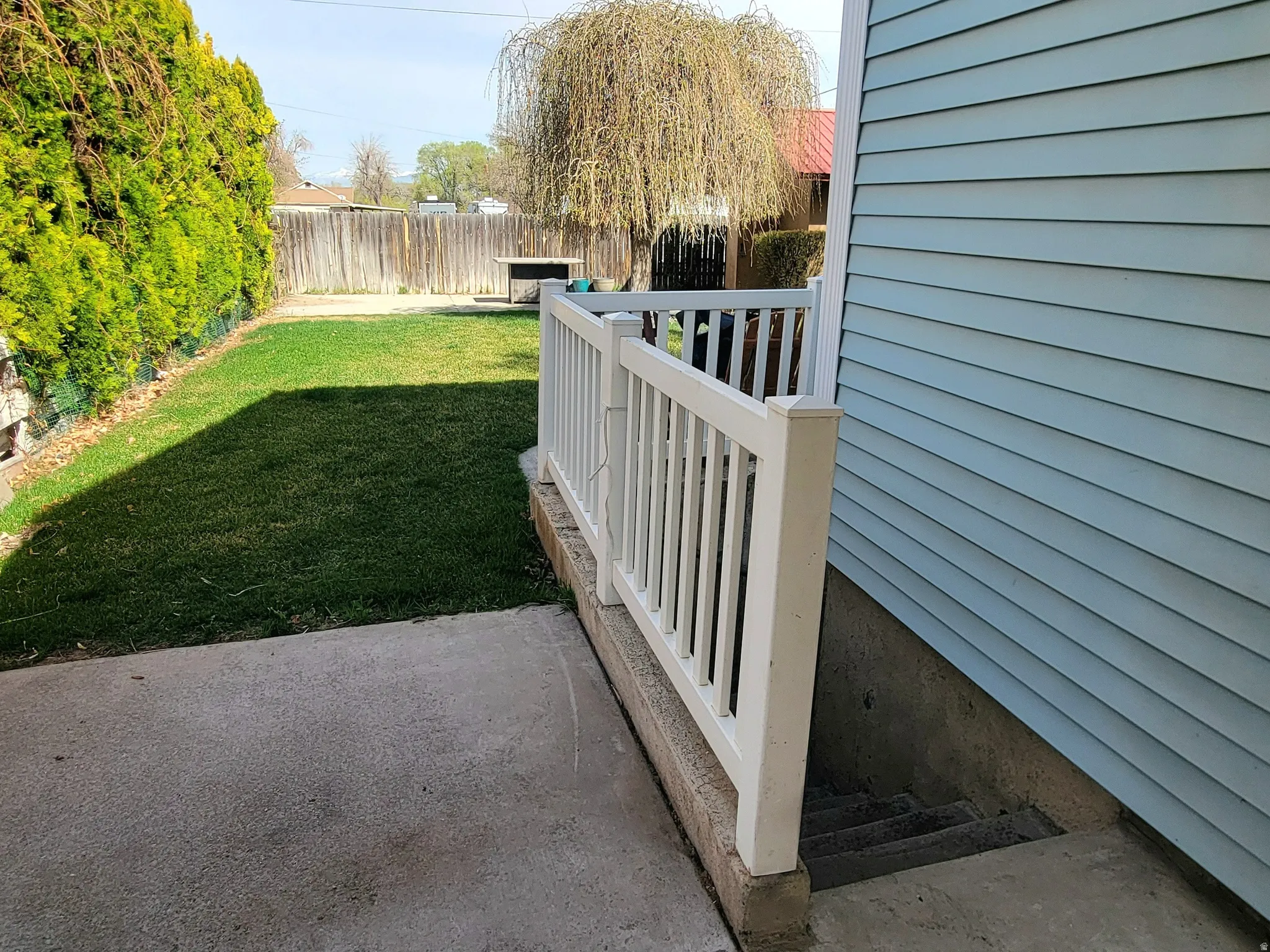 Fenced backyard featuring a patio area