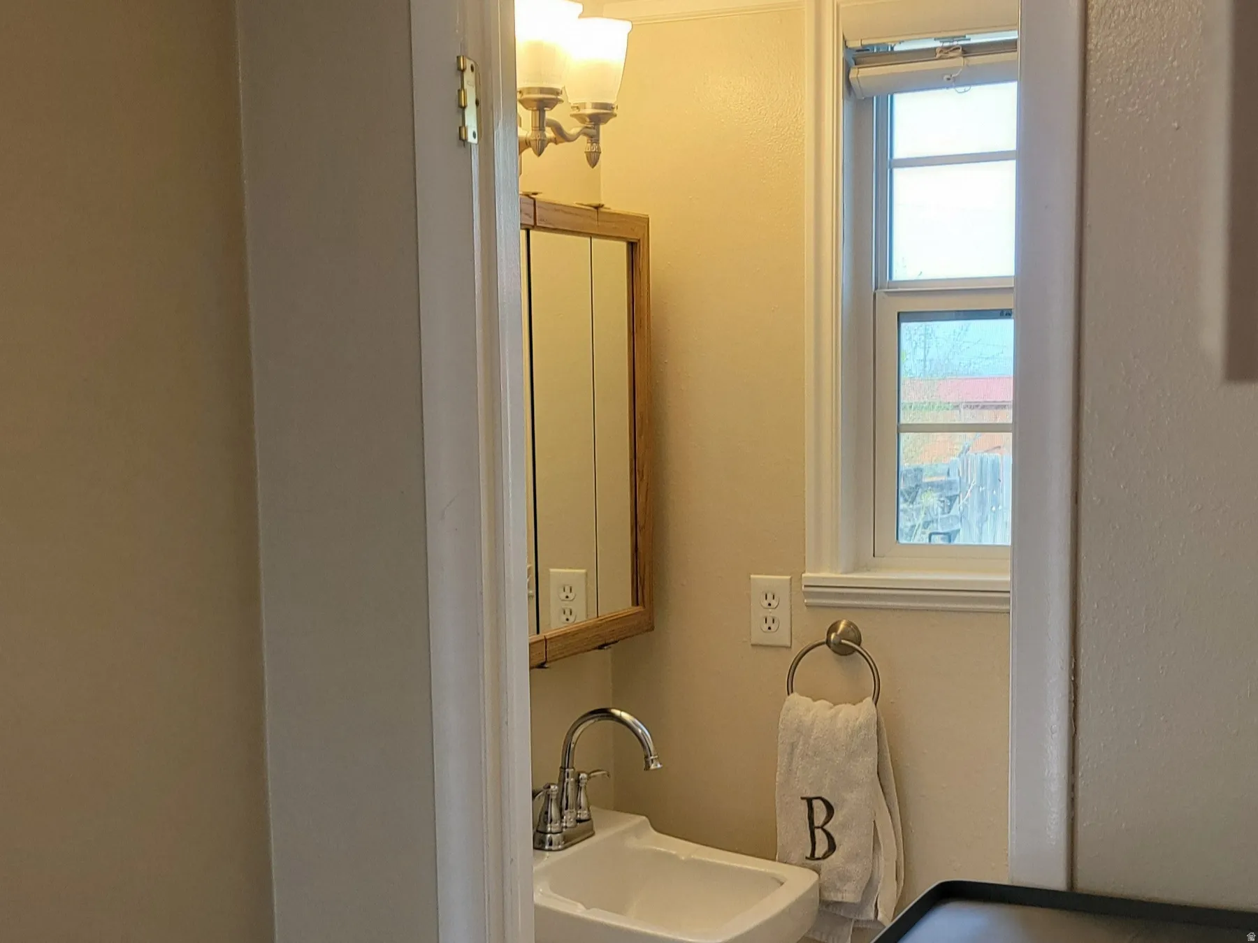 Bedroom with washer / clothes dryer and a sink