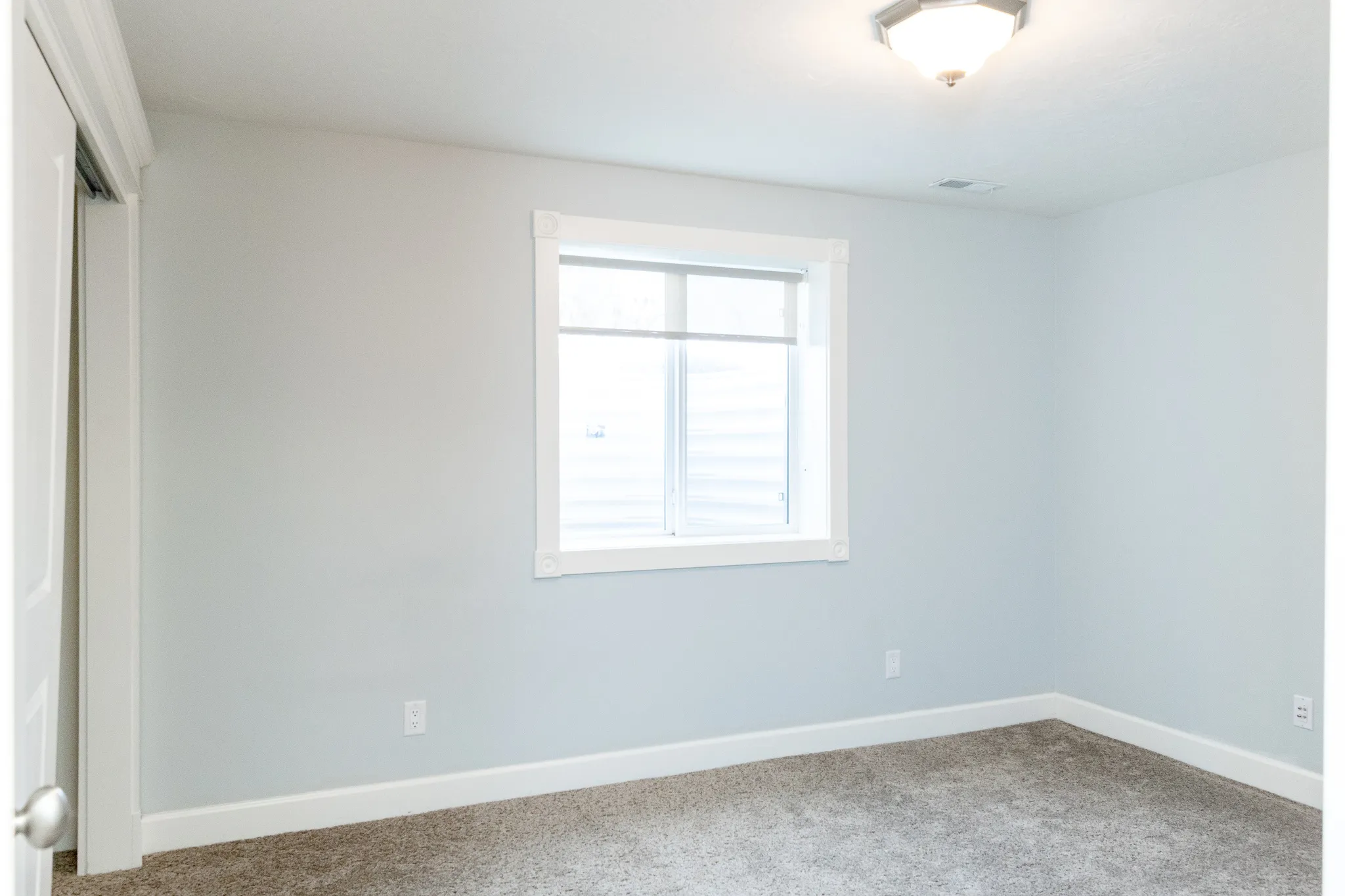 Unfurnished bedroom featuring a closet and carpet floors