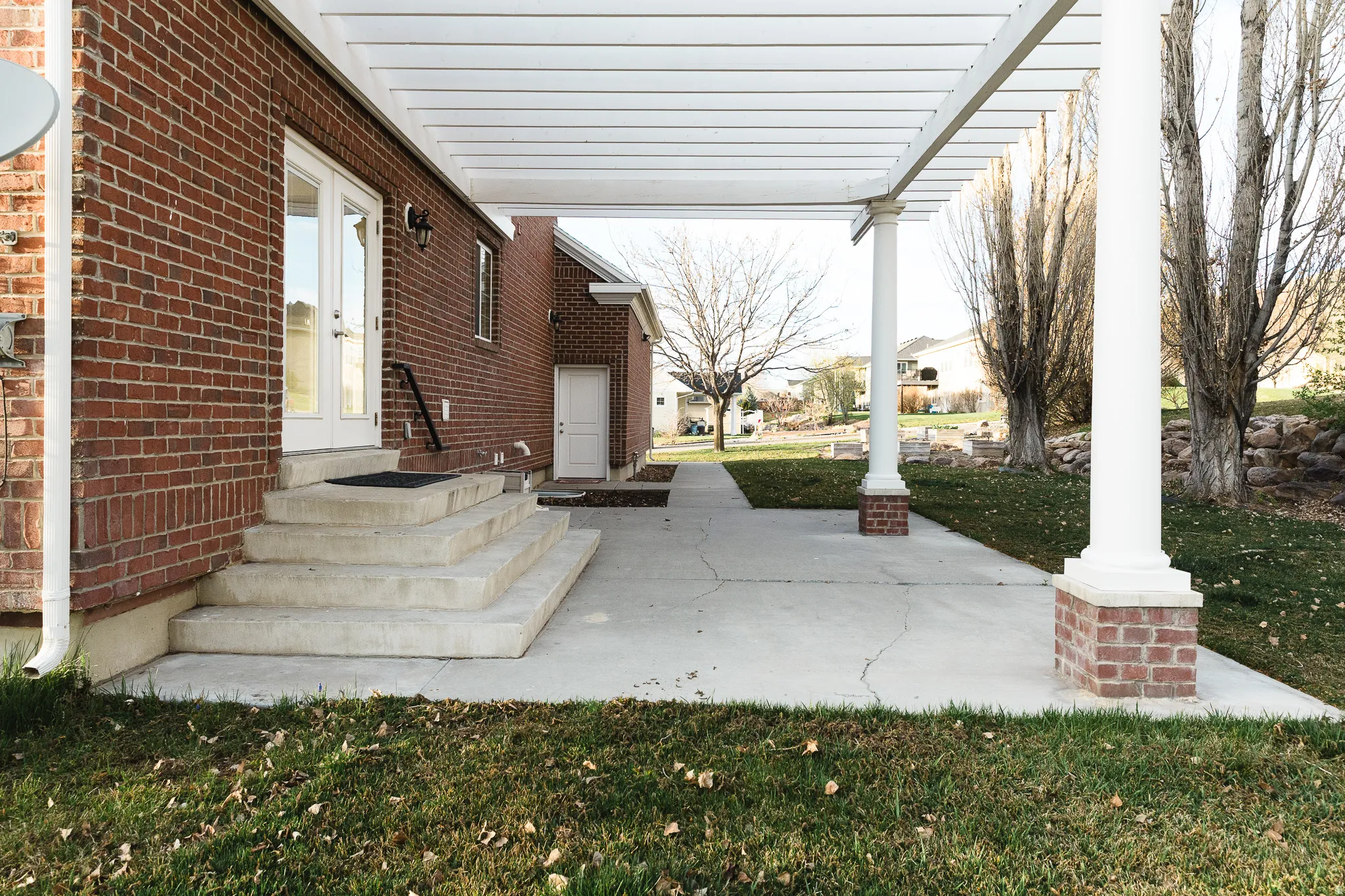 View of patio / terrace featuring entry steps and a residential view