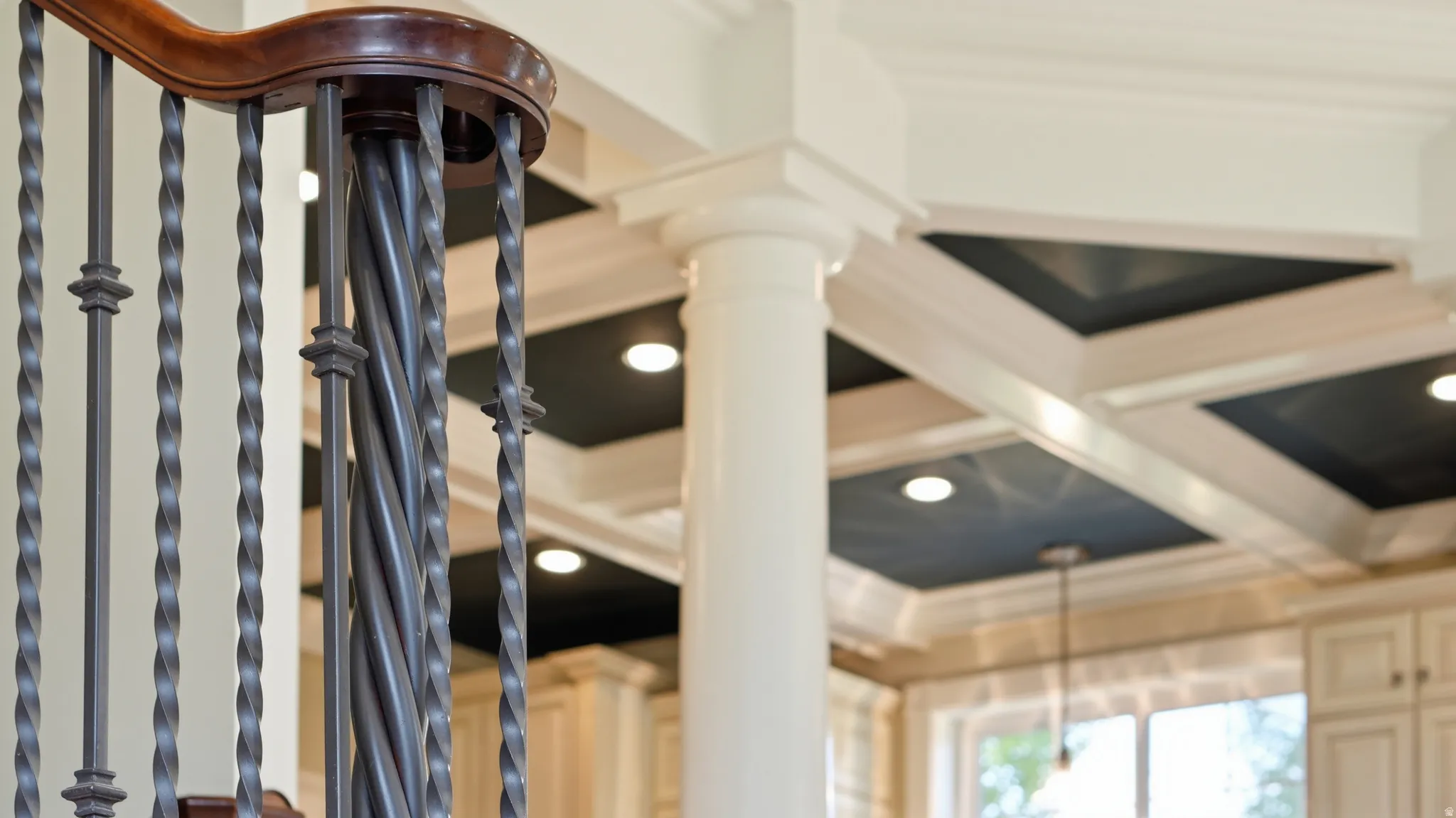 Dark wood-finish handrail with wrought iron balusters