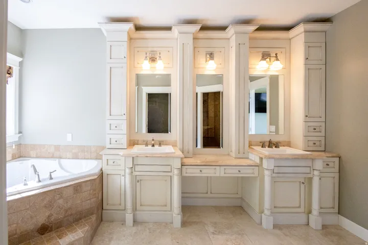 Bathroom with double vanity and a garden tub