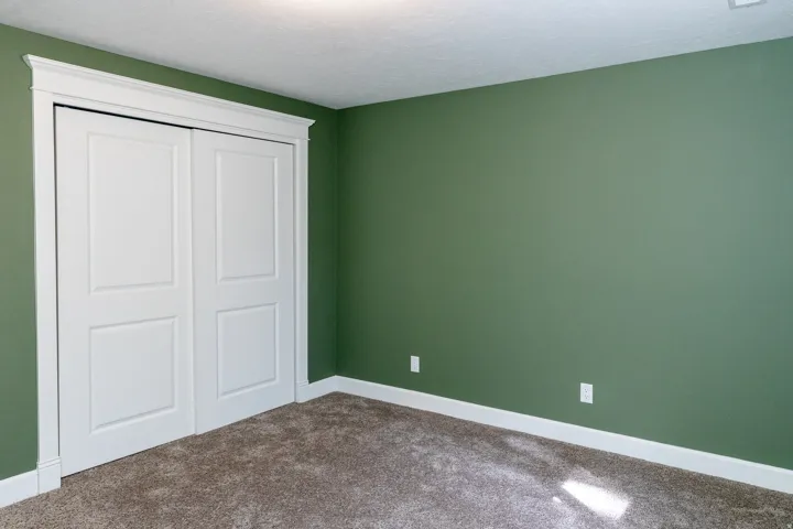 Unfurnished bedroom featuring carpet floors, a closet, and a textured ceiling