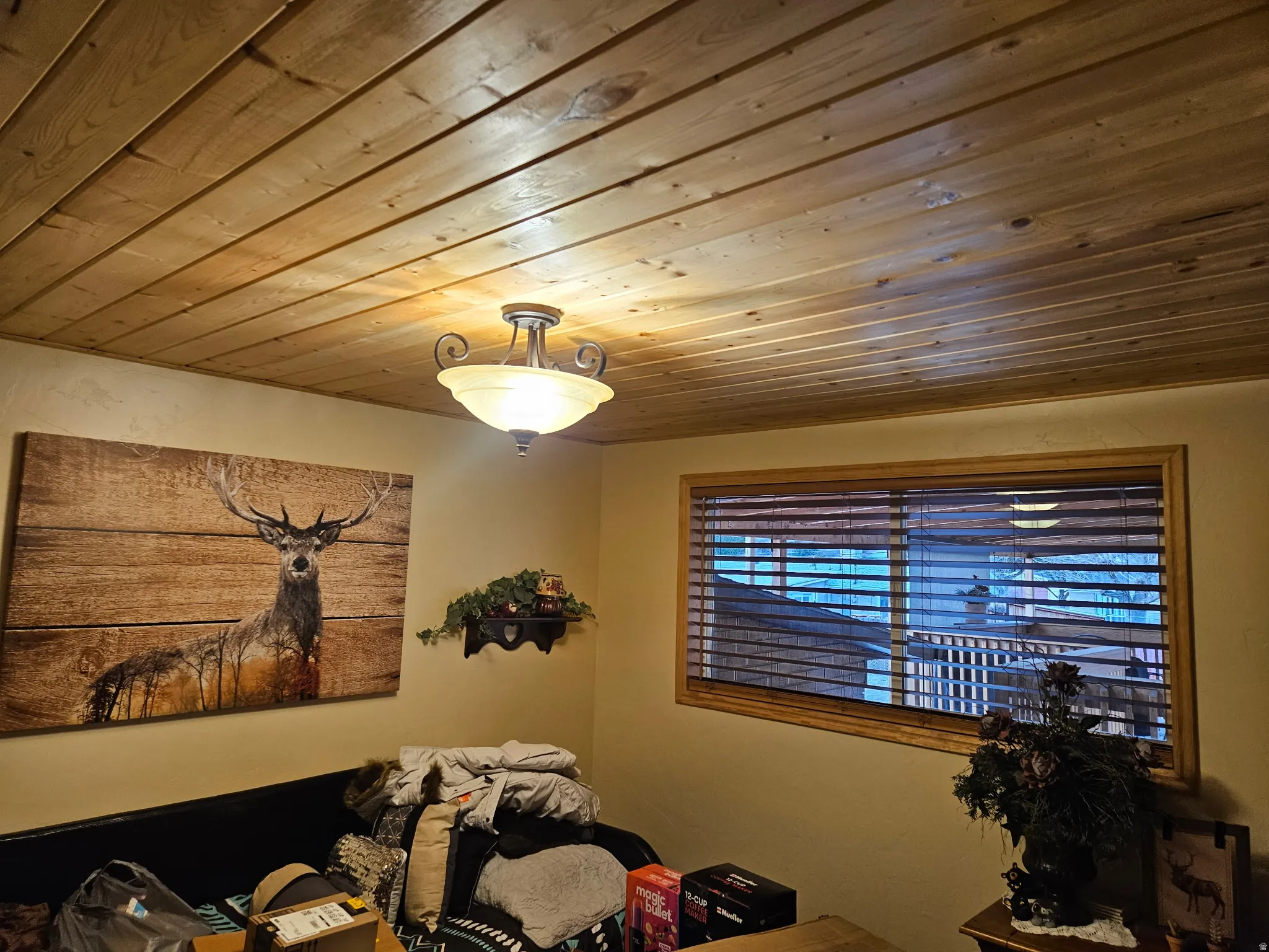 Bedroom with wood ceiling