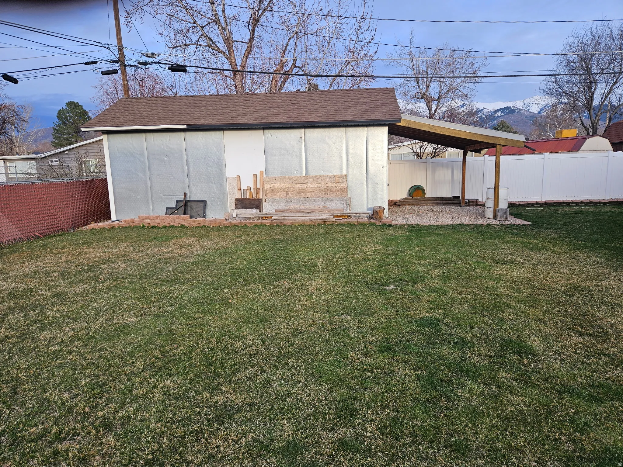 View of outdoor structure featuring a fenced backyard