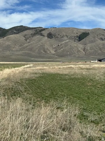 View of mountain background featuring rural landscape