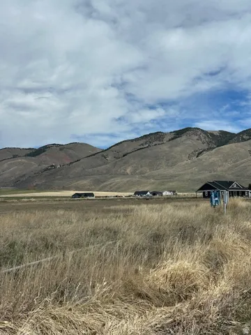 View of mountain backdrop featuring rural landscape