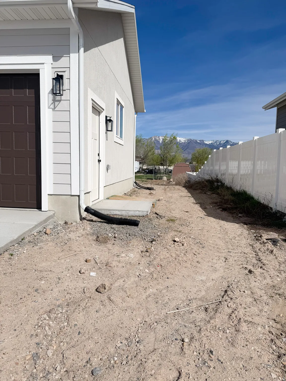 View of side of property with a mountain view