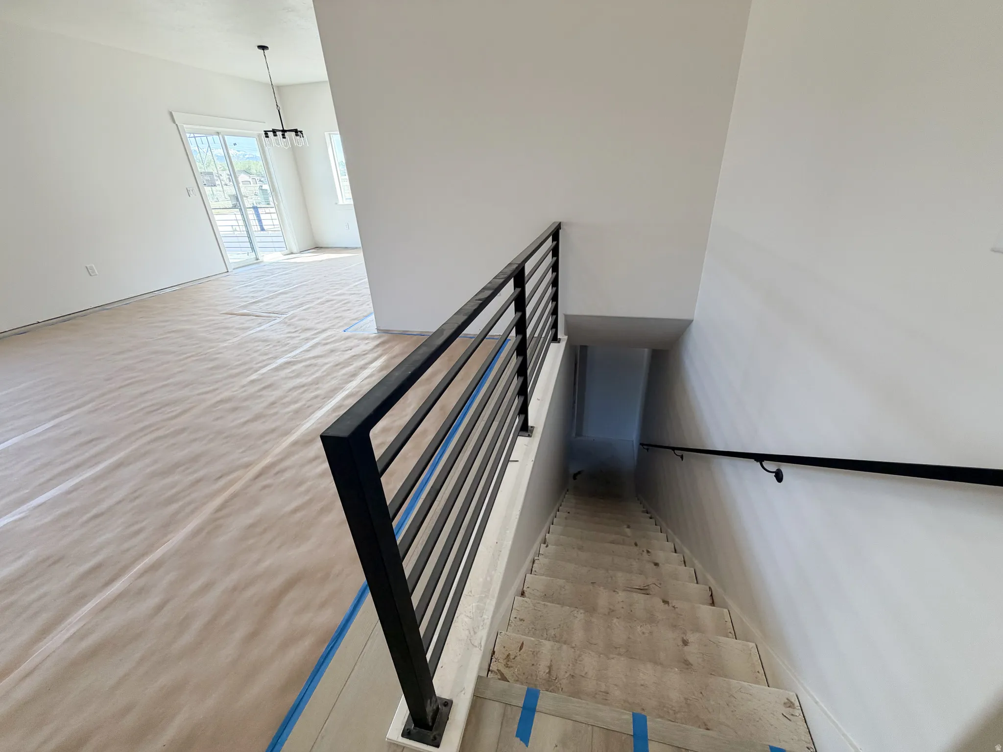 Staircase with a chandelier