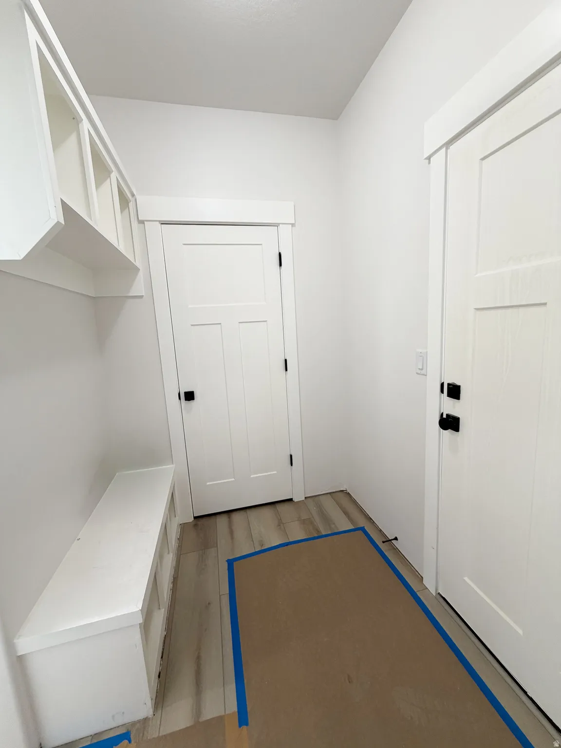 Mudroom featuring light wood-style flooring