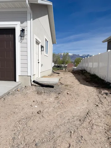 View of side of property with a mountain view