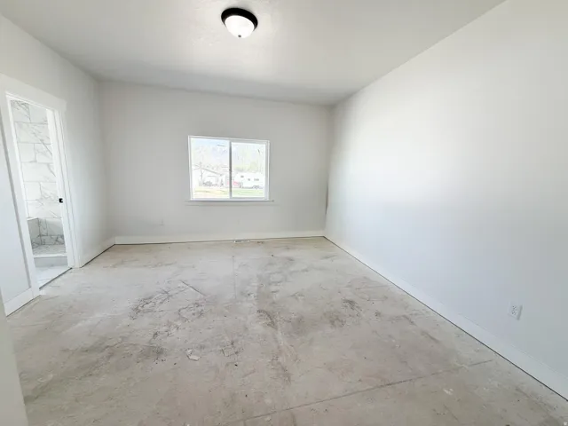 Unfurnished room with baseboards