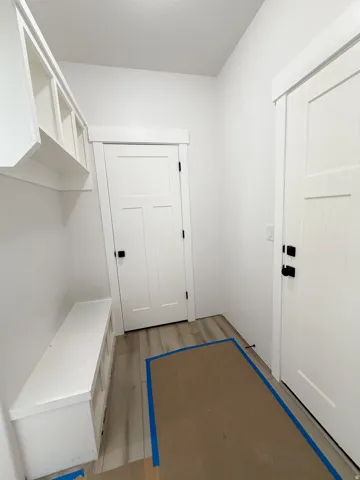 Mudroom featuring light wood-style flooring