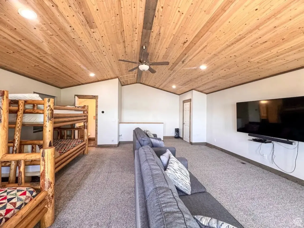 Carpeted bedroom featuring recessed lighting, ceiling fan, and wooden ceiling