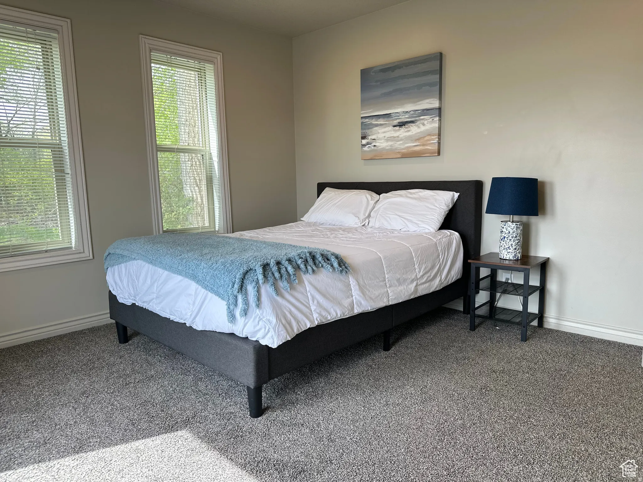 Carpeted bedroom with baseboards