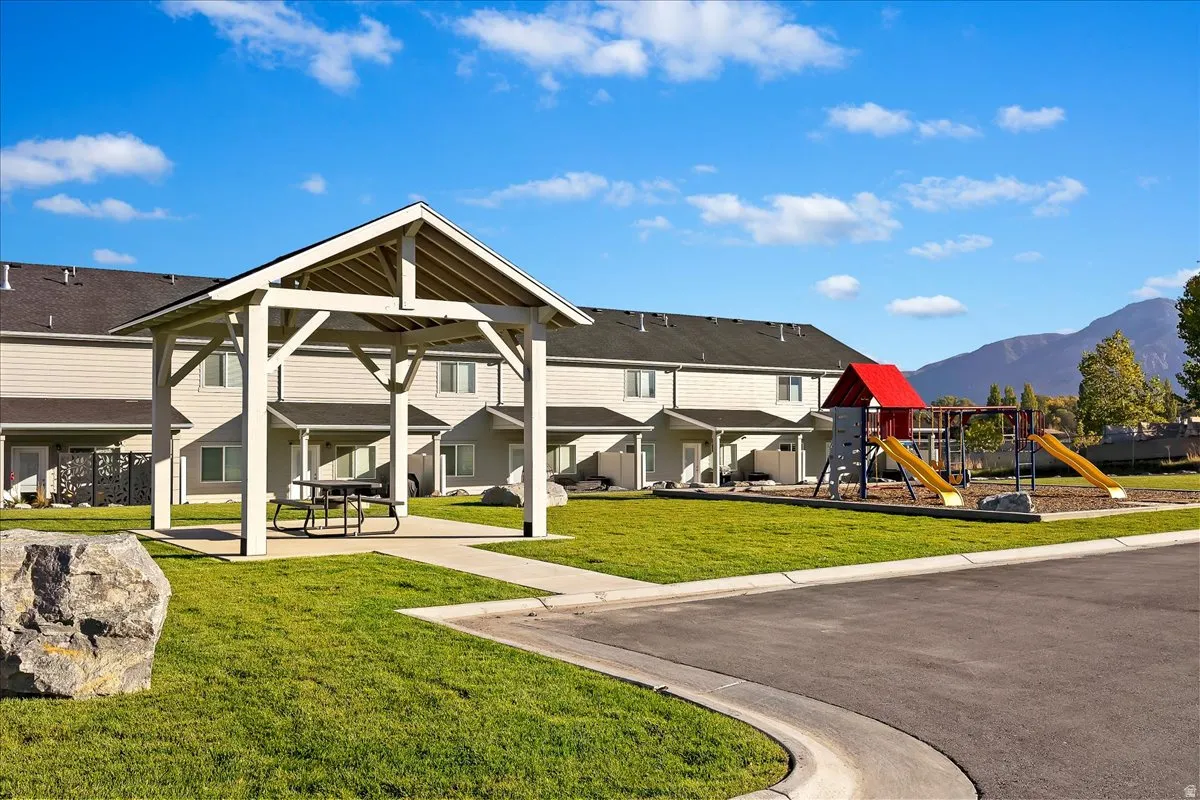 View of home's community with a patio area and a mountain view