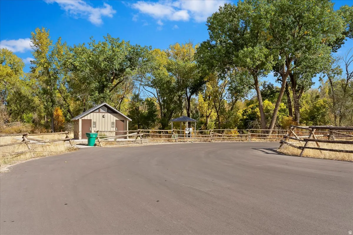 View of asphalt road featuring view of scattered trees
