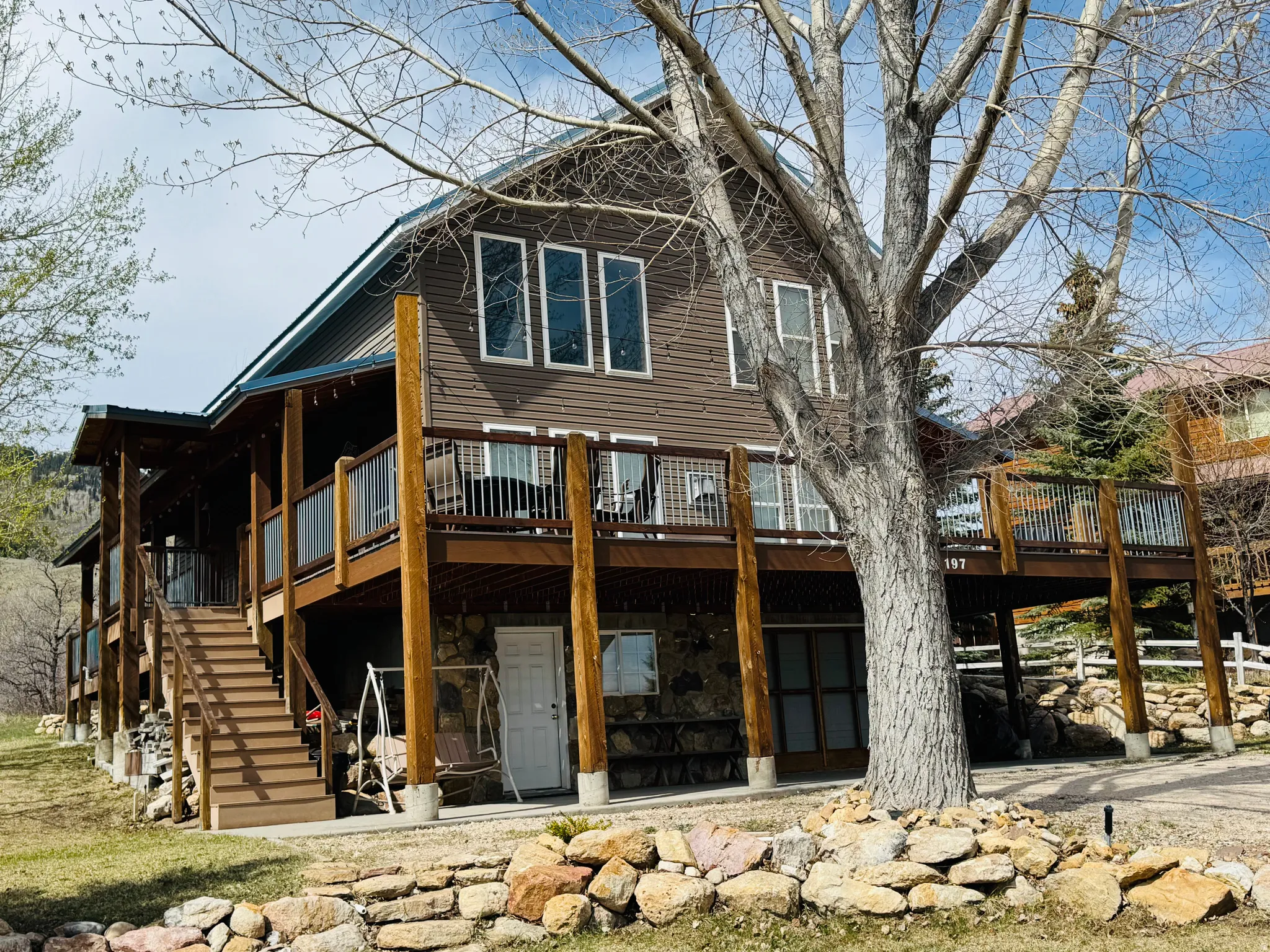 Rear view of house with a wooden deck