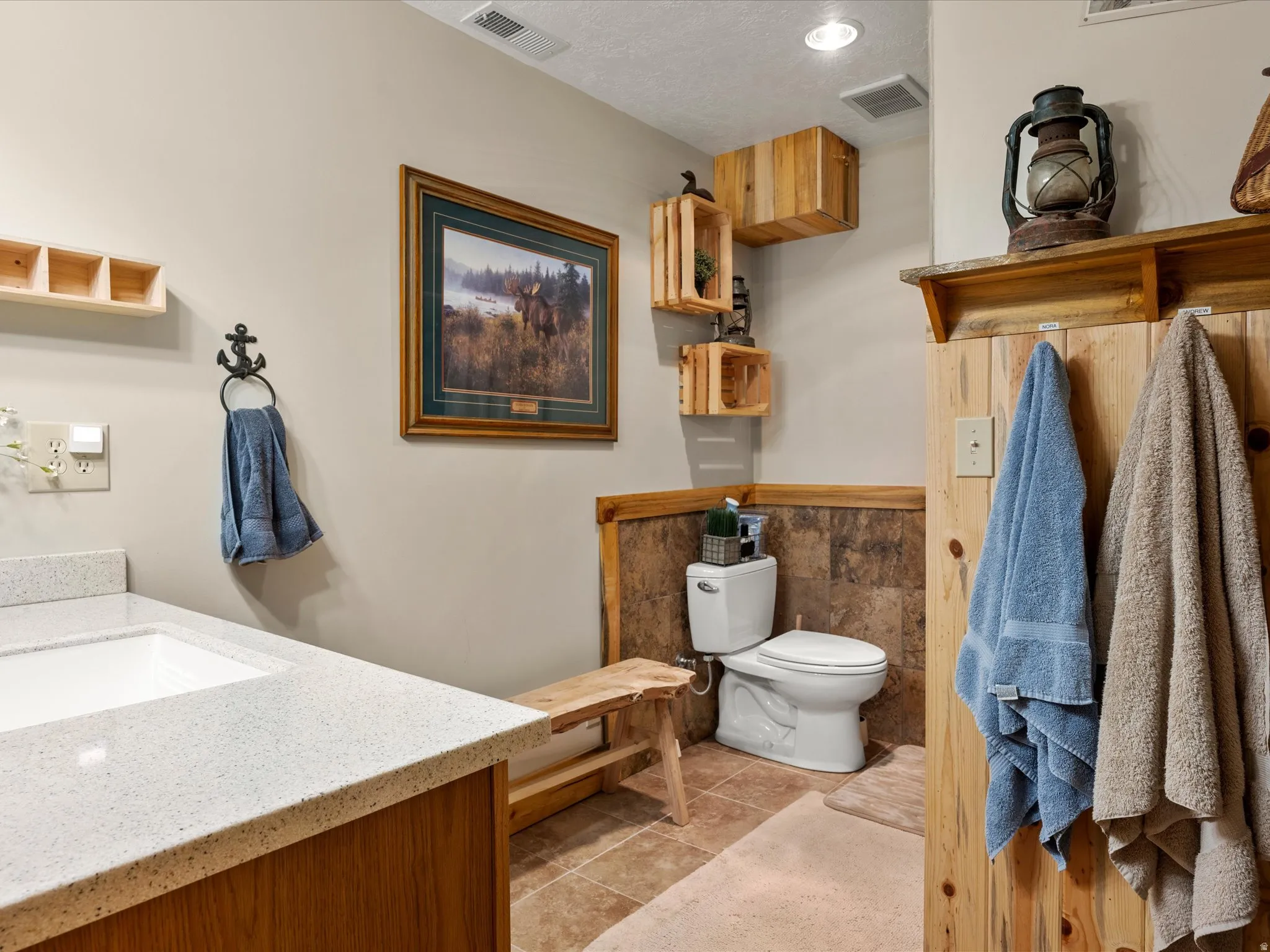 Bathroom with vanity and light tile patterned flooring
