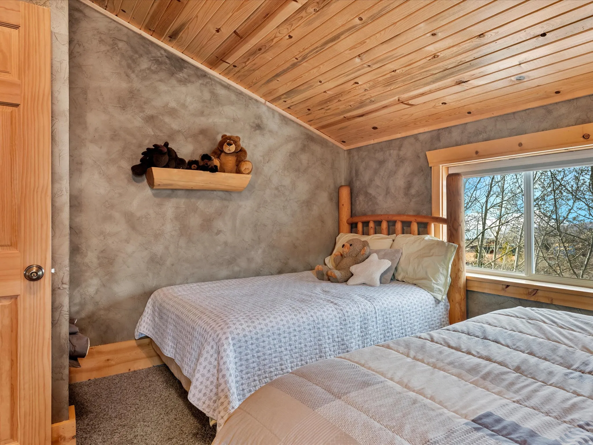 Bedroom featuring a vaulted wooden ceiling and wood finished floors