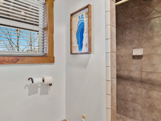 Bathroom featuring a shower stall