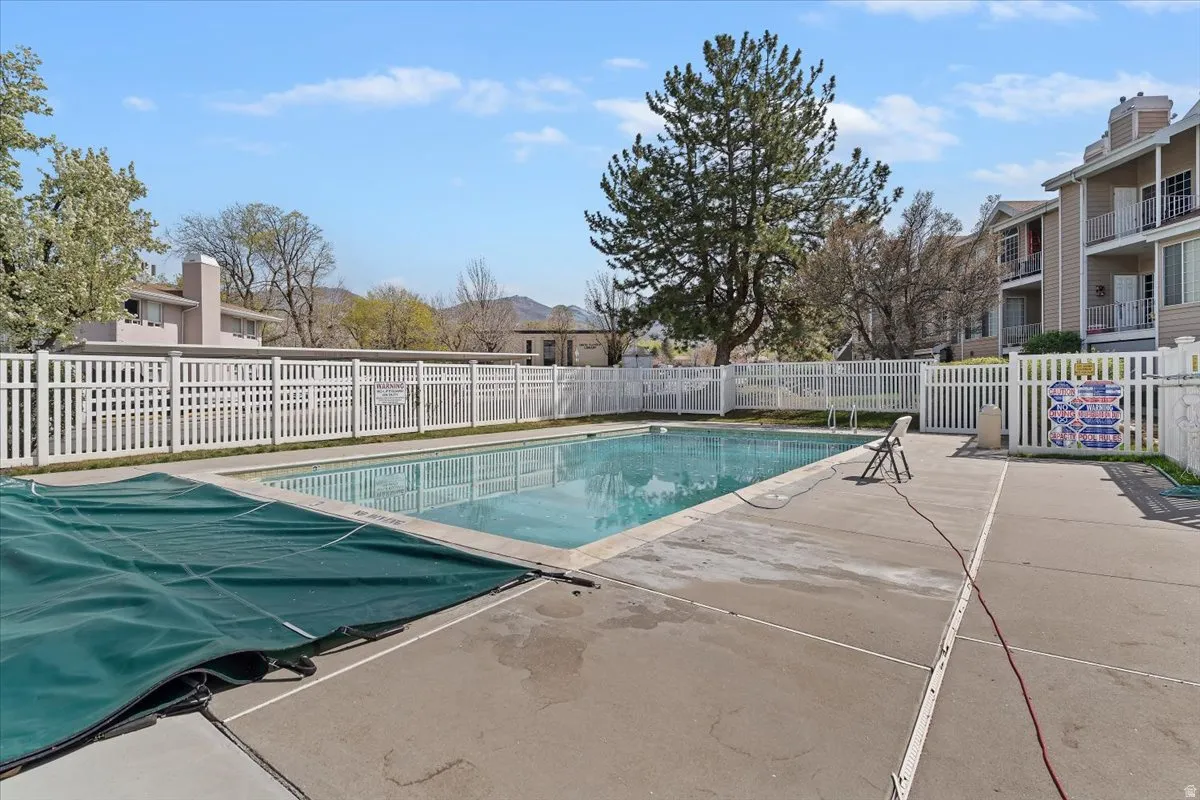 Community pool with a patio area