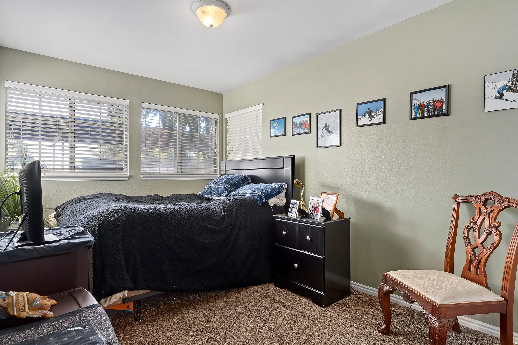 Carpeted bedroom featuring baseboards