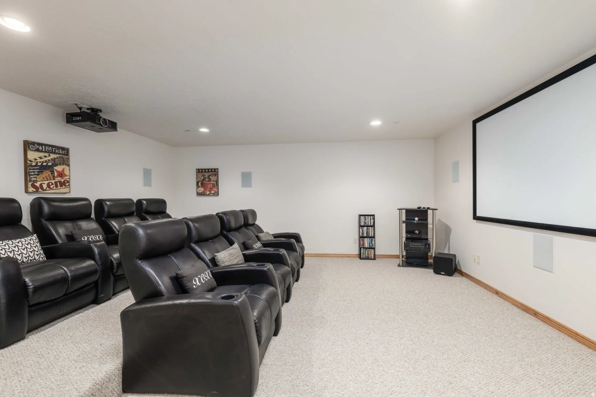 Home theater featuring light colored carpet and recessed lighting